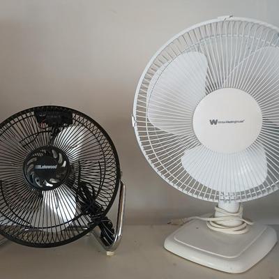 Two fans , Lakewood freestanding fan and a White Westinghouse oscillating fan
