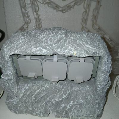 Outdoor Christmas decorations snowflake lights with star an extension cord and a faux hide a cord rock in tote