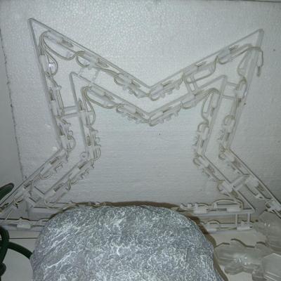 Outdoor Christmas decorations snowflake lights with star an extension cord and a faux hide a cord rock in tote