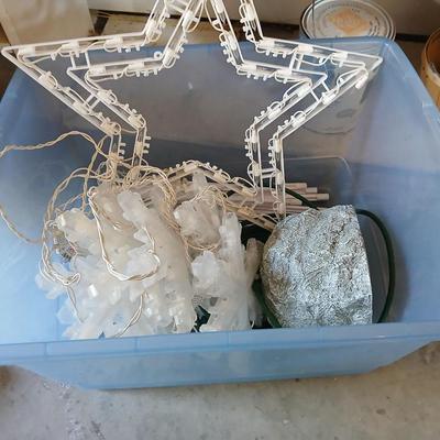 Outdoor Christmas decorations snowflake lights with star an extension cord and a faux hide a cord rock in tote