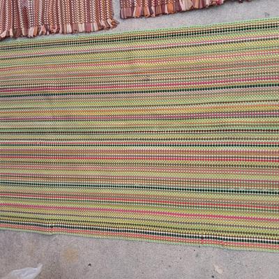Three fabric throw rugs