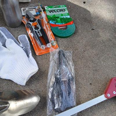 Gardening hand tools, gloves, tarp with a canvas bag and more