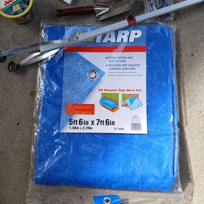 Gardening hand tools, gloves, tarp with a canvas bag and more