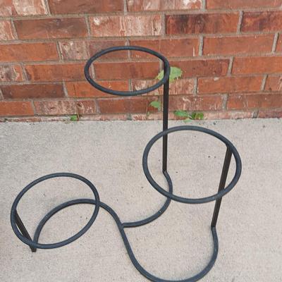 Wrought Iron plant stand with faux purple flowers and two pots