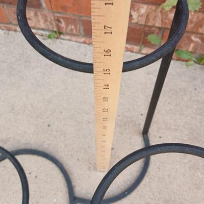 Wrought Iron plant stand with faux purple flowers and two pots