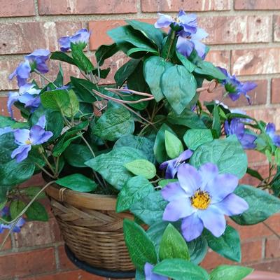 Wrought Iron plant stand with faux purple flowers and two pots