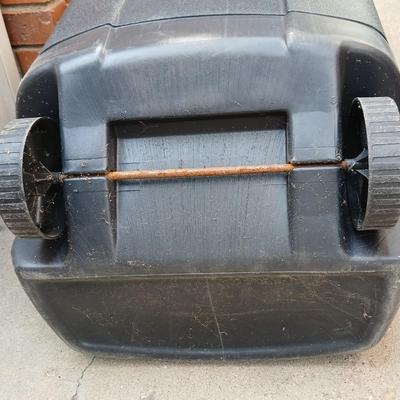 Wheeled trashcan with lid and a yard tool organizer