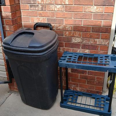 Wheeled trashcan with lid and a yard tool organizer