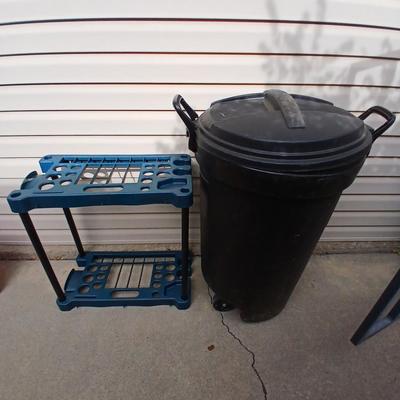Trash can on wheels with a yard tool organizer