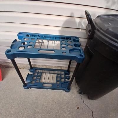 Trash can on wheels with a yard tool organizer