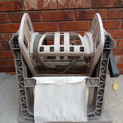 Patio storage box and a hose reel