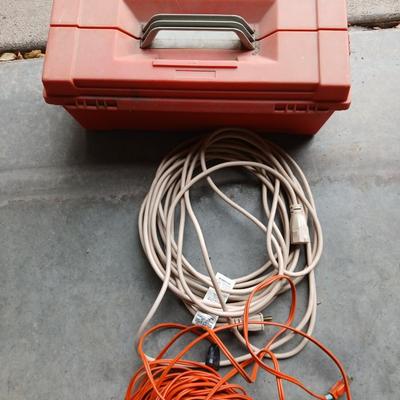 Plastic toolbox with extension cords Electrical hand tools and plugs