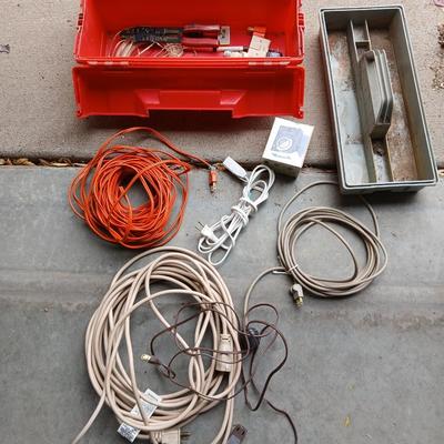 Plastic toolbox with extension cords Electrical hand tools and plugs