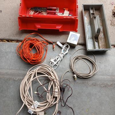 Plastic toolbox with extension cords Electrical hand tools and plugs
