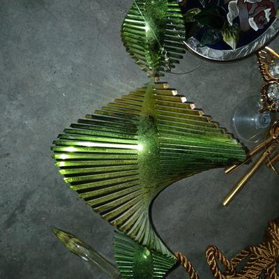 Ceramic plant pots and whirl gig yard art with a new pocket hose