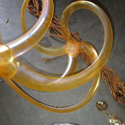 Ceramic plant pots and whirl gig yard art with a new pocket hose
