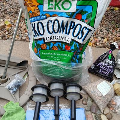 USA Flag on pole, Compost, a new tarp and a few misfit garden items