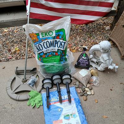 USA Flag on pole, Compost, a new tarp and a few misfit garden items