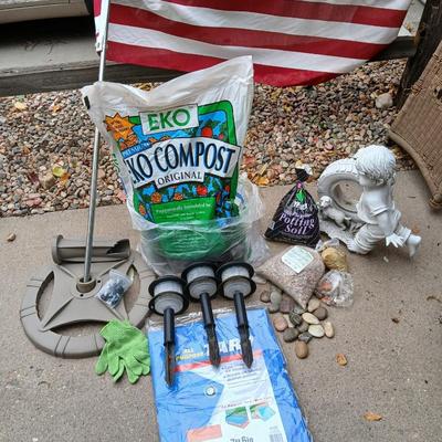USA Flag on pole, Compost, a new tarp and a few misfit garden items