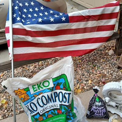 USA Flag on pole, Compost, a new tarp and a few misfit garden items