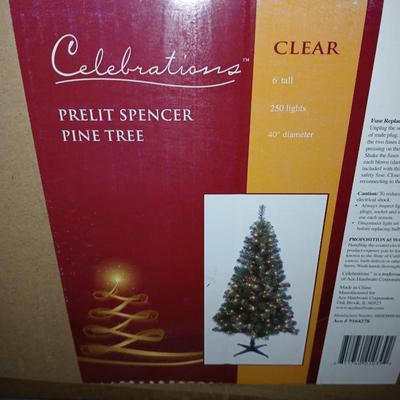 Faux 6' pre lit Christmas tree Spencer pine with decorations and other Christmas ornaments