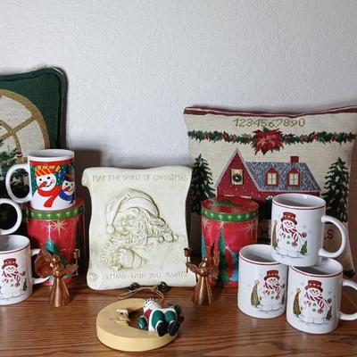 Christmas throw pillows, Mugs, copper-colored angels, plaque and more
