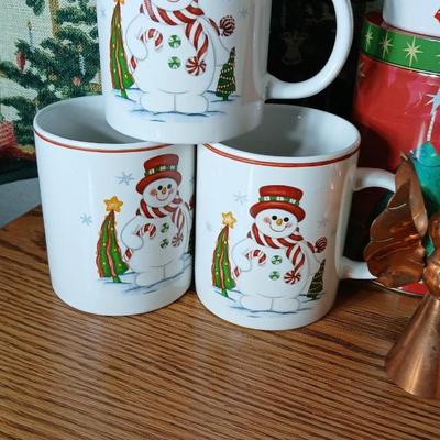 Christmas throw pillows, Mugs, copper-colored angels, plaque and more