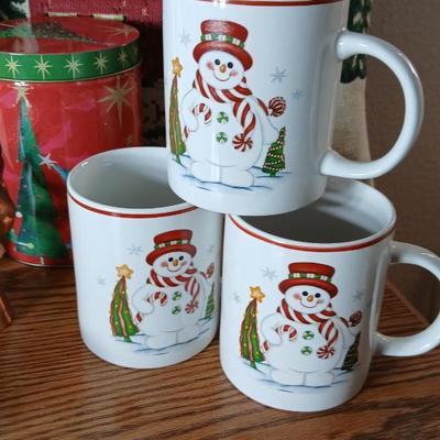 Christmas throw pillows, Mugs, copper-colored angels, plaque and more