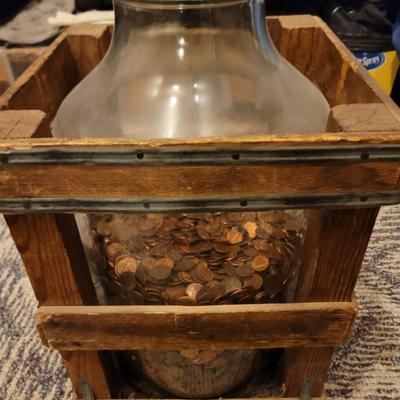 Sale Photo Thumbnail #1019: Hard to say how long this collection has been going on, Jar is about 10" in diameter and 19" tall, there are about 8 inches of pennies in the jar