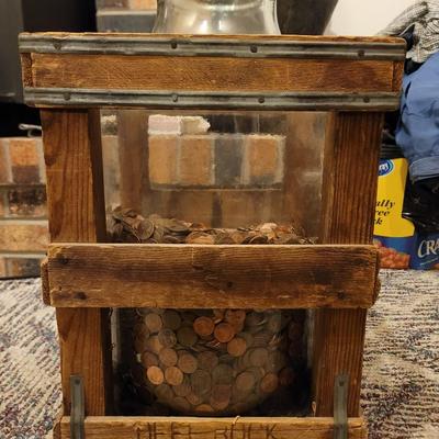 Deet rock water Co crate and big jar of pennies