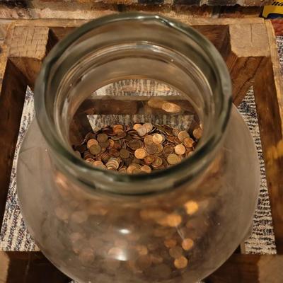 Sale Photo Thumbnail #1020: Hard to say how long this collection has been going on, Jar is about 10" in diameter and 19" tall, there are about 8 inches of pennies in the jar