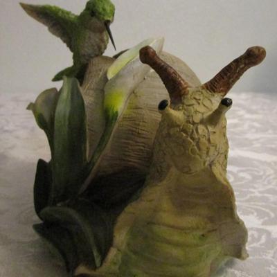 Snail and hummingbird sculpture