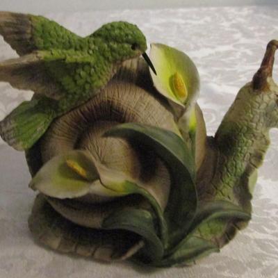 Snail and hummingbird sculpture