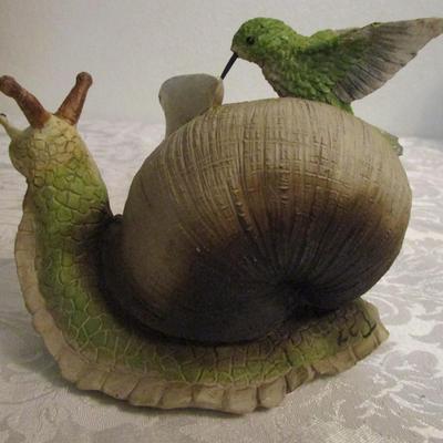 Snail and hummingbird sculpture