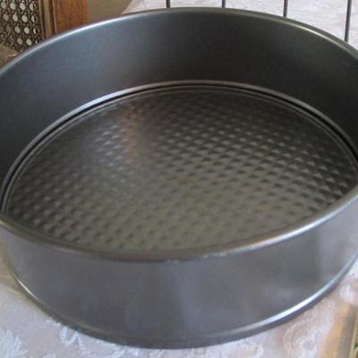 Tupperware coarse grater, roasting rack, hot pads, coasters, 9" springform cake pan, recipe tab index cards