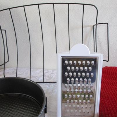 Tupperware coarse grater, roasting rack, hot pads, coasters, 9" springform cake pan, recipe tab index cards