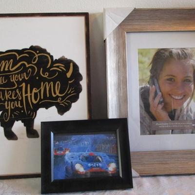 Picture frames, Buffalo art (says " Roam 'Til Your Heart Takes You Home" 