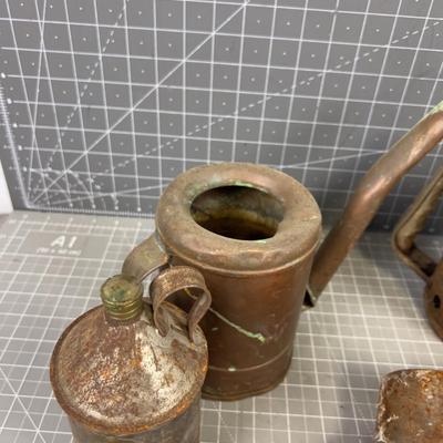 Pile of Vintage Oil Cans and Funnels