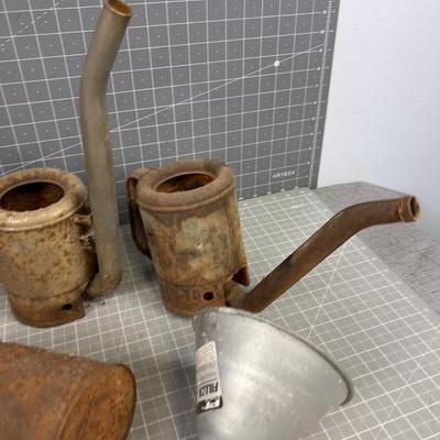 Pile of Vintage Oil Cans and Funnels