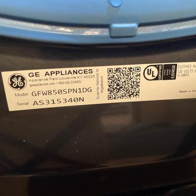 GE front load washer and dryer on pedestals