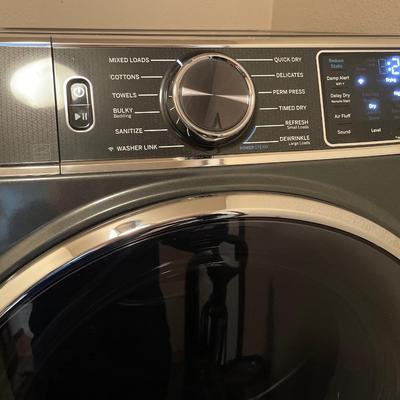 GE front load washer and dryer on pedestals