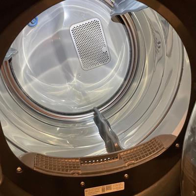 GE front load washer and dryer on pedestals