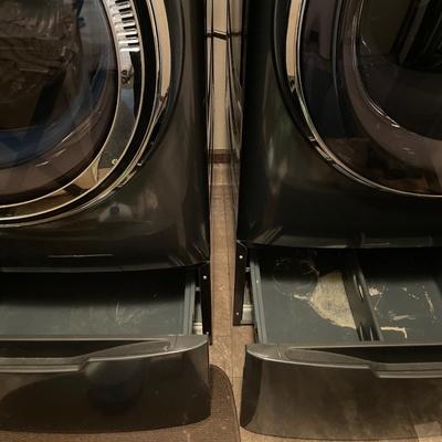 GE front load washer and dryer on pedestals