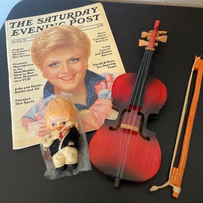 Vintage magazine, with guitar and wood violin