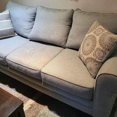 Light blue/gray couch, seat 3