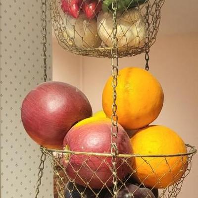 Hanging attached hanging wire baskets with decorative fruit and vegetables
