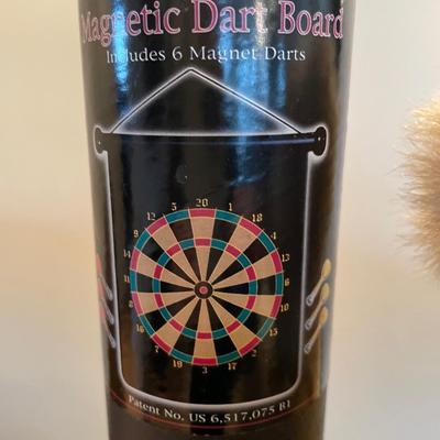 Magnetic dart board and stuffed animals