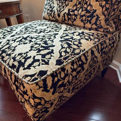 Two cream and black custom chairs from the Design Source