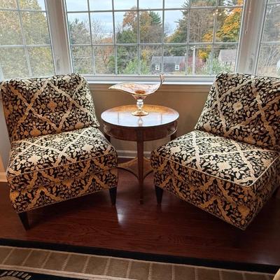 Two cream and black custom chairs from the Design Source