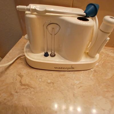 Waterpik machine with razor and a new nightlight